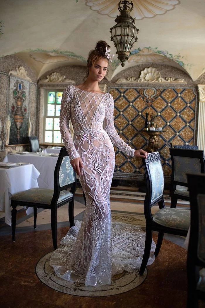 vintage restaurant, lace dress, with long train, sparkly wedding dress, brown hair, in a messy bun