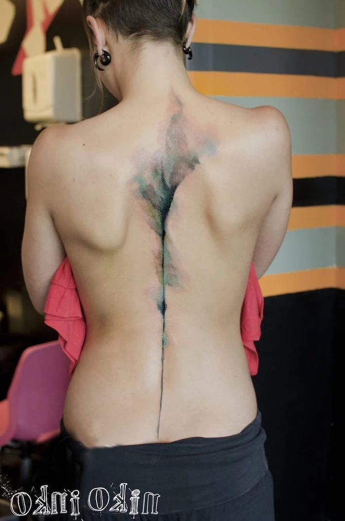 watercolour tattoo, along the spine, watercolor tree tattoo, brown hair, black pants