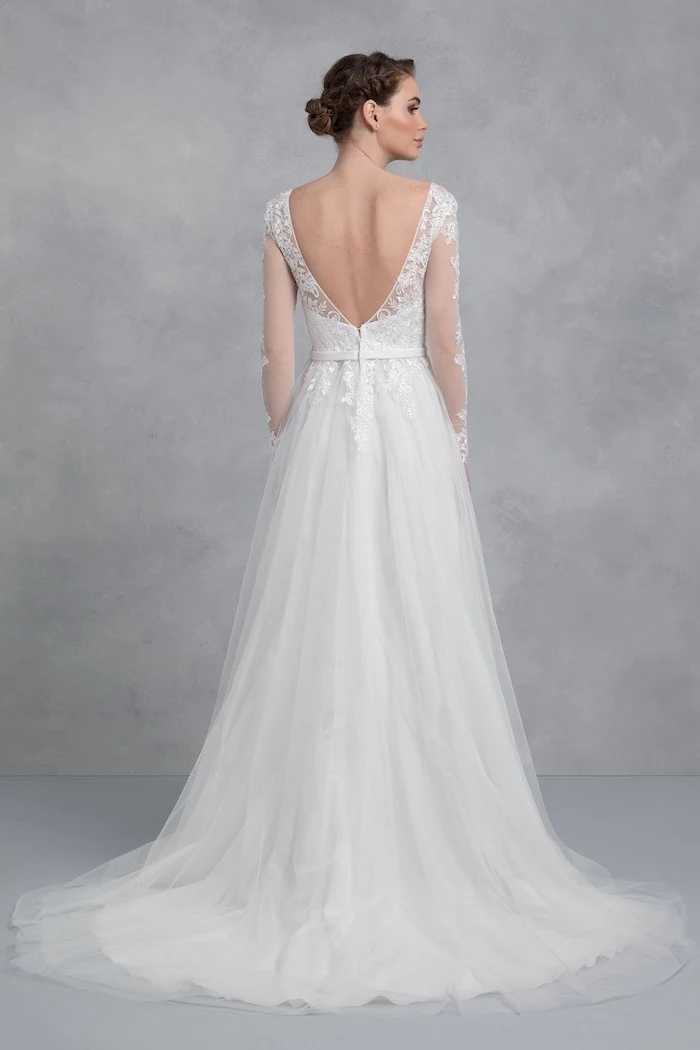 bare back, long white dress, gowns with sleeves, made of tulle and lace, brown hair, in a low updo