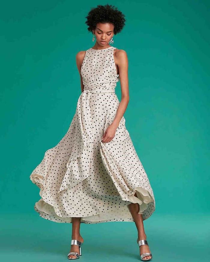 white dress, black dots, black curly hair, silver sandals, blue background, mother of the bride gowns