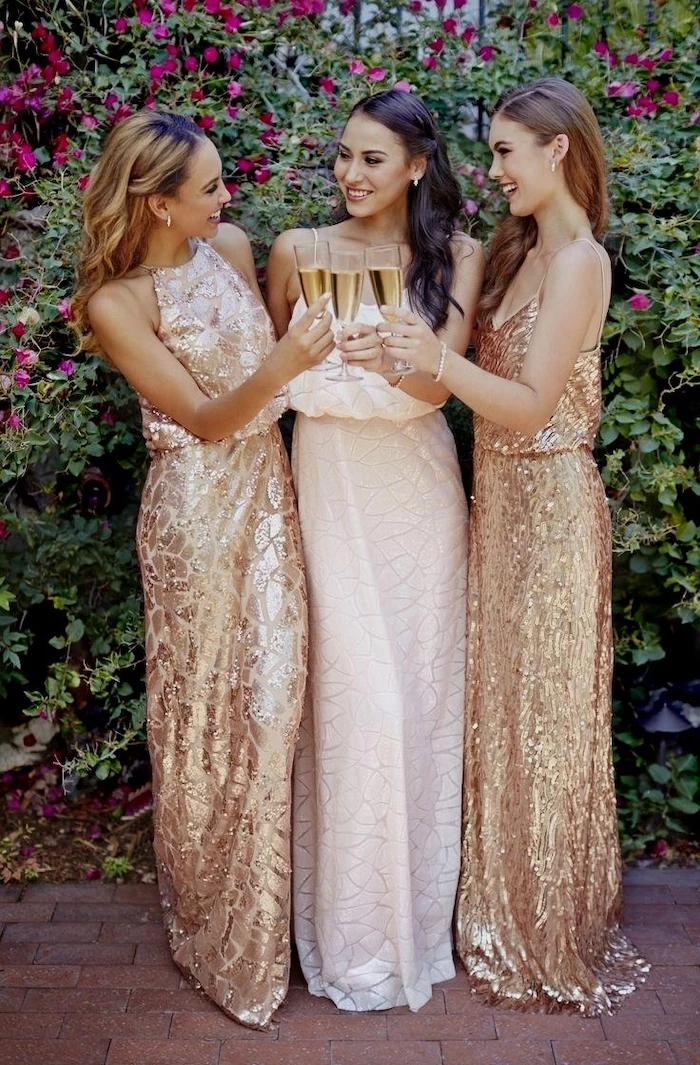 white and gold dresses, champagne flutes, sequin bridesmaid dresses, three women smiling