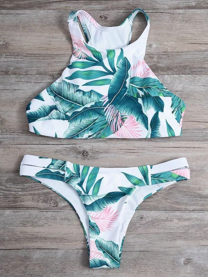 two piece, white with green palm leaves print, pineapple bathing suit, wooden background