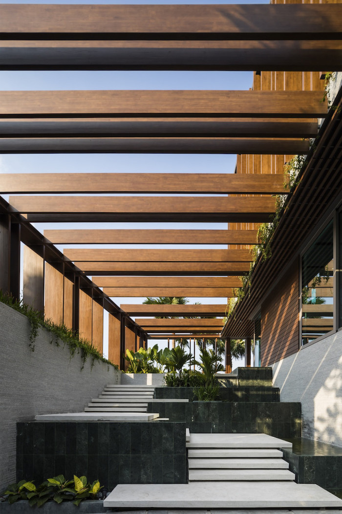 intricate staircase, dark marble flower beds, screened in porch ideas, wooden ceiling