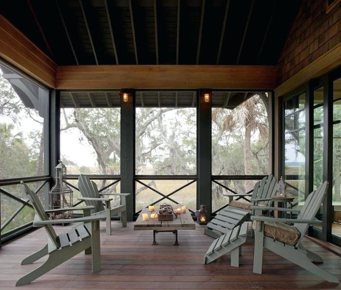 grey wooden chairs, small wooden table, screened in porch, front porch pictures, candles everywhere