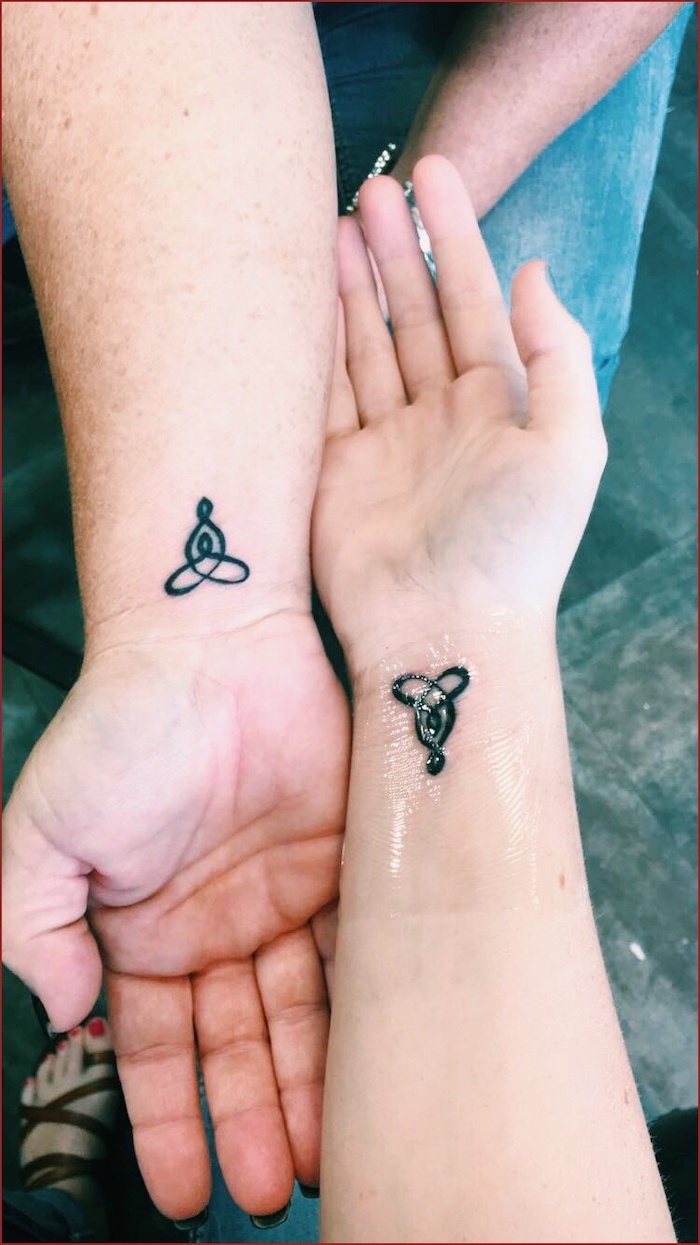 wrist tattoos, matching mother daughter tattoos, celtic symbols