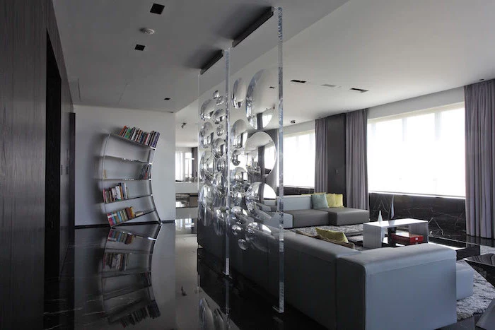 room dividers, two separate, made of glass, intricate design, large grey corner sofa, black floor