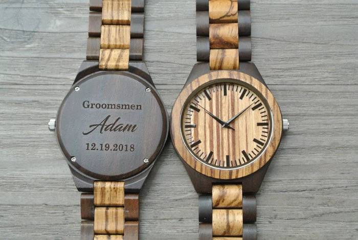 groomsmen gifts, wooden watch, personalised with name and date, on a wooden background
