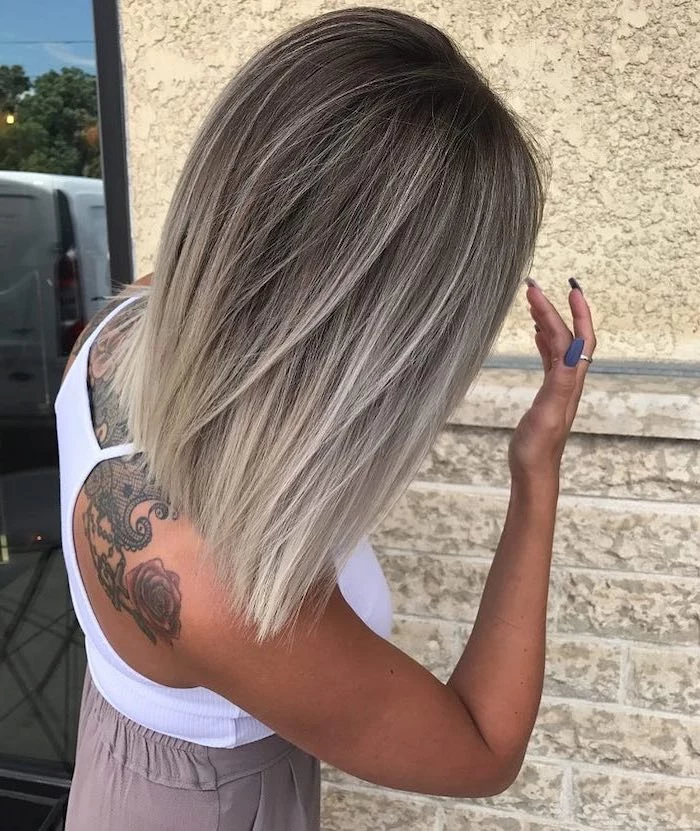 dark blonde, to ash grey, short and straight hairstyle, white top, pink ombre hair, back tattoo