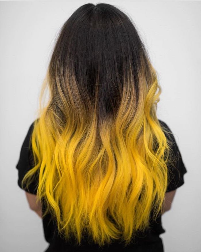 ombre hair color, black to yellow, long wavy hair, black shirt, white background
