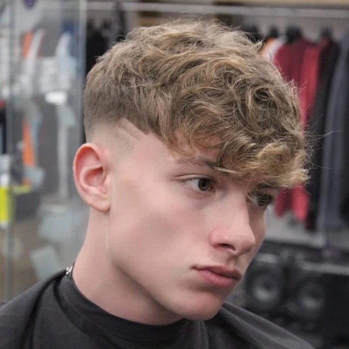 blonde curly hair, cute boy haircuts, blurred background
