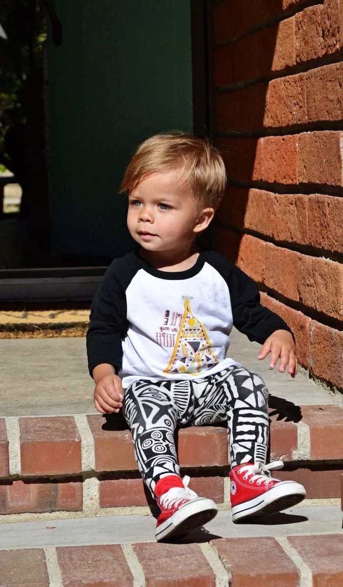 little boy haircuts, toddler boy, sitting on a step, black and white outfit, red converse shoes, brick wall