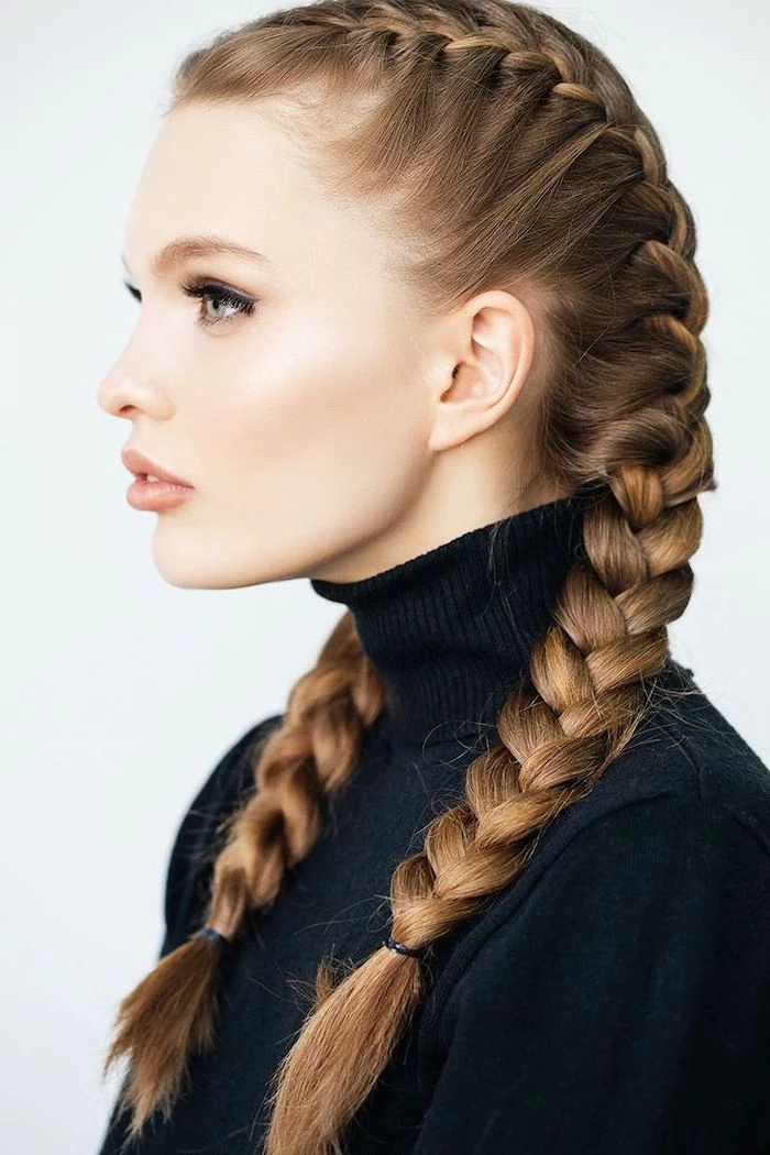 blonde hair, in two side braids, black braided hairstyles, black polo sweater, white background
