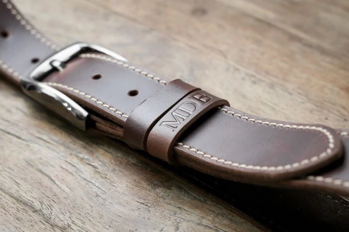 brown leather belt, personalised with initials, cool groomsmen gifts, wooden background