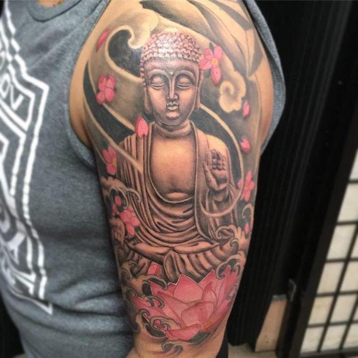 arm tattoo ideas, pink lotus flowers, buddha in the middle, grey top