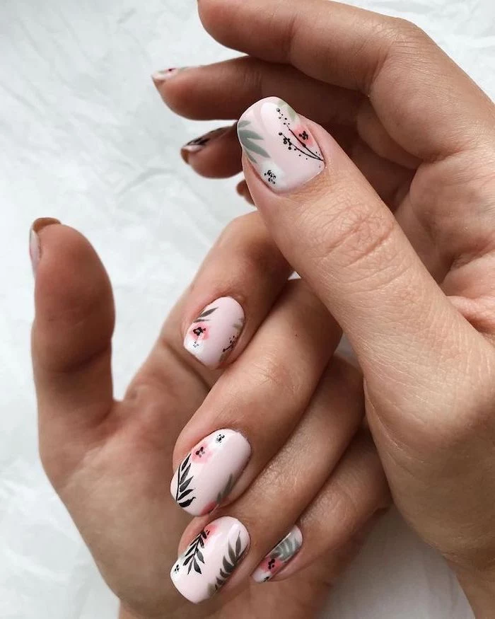 pink nail polish, pink flowers, green leaves, fall nail designs, white background