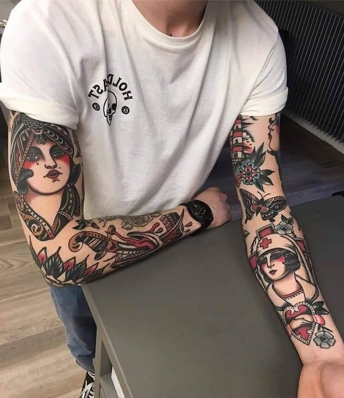 white t shirt, wooden floor, black table, arm tattoo ideas, coloured tattoos, on both arms