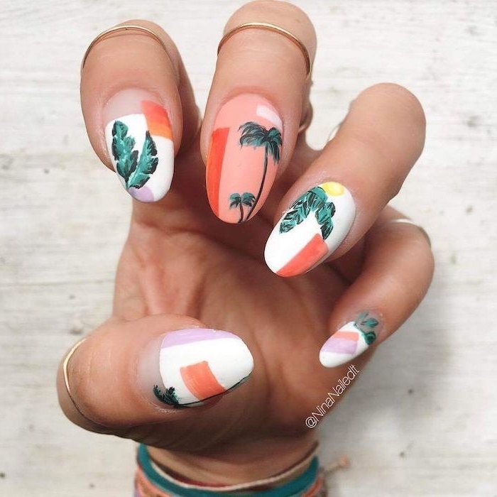 manicure ideas, orange and white nail polish, green palm trees, gold rings, white background