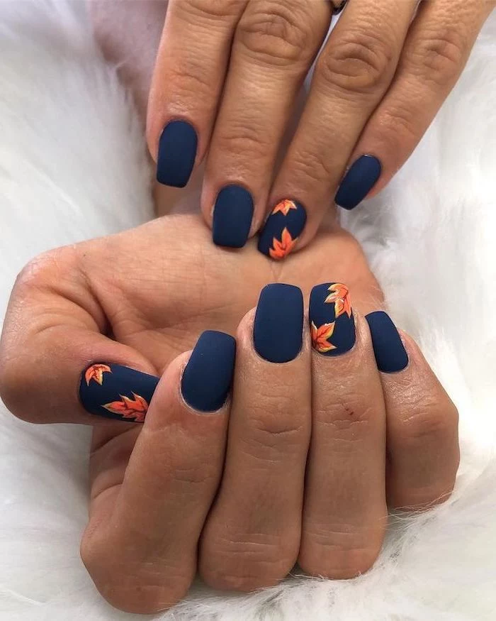 dark blue matte, nail polish, orange leaves, spring nail designs, short nails, white background