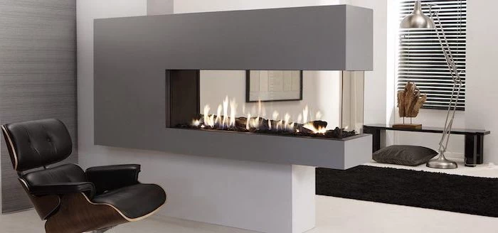 electric fireplace, black leather armchair, room divider screen, white floor, black carpet