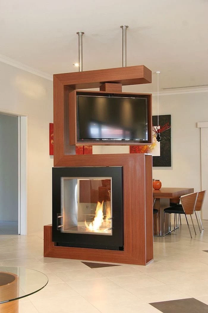 electric fireplace, rotating tv, wooden room dividers, tiled floor, wooden chairs, dining table