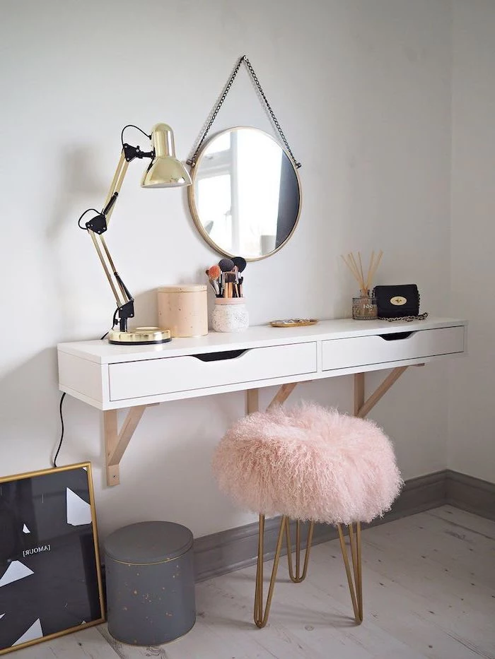 floating shelf with drawers, makeup vanity, metal stool, pink furry cover, wooden floor, white wall