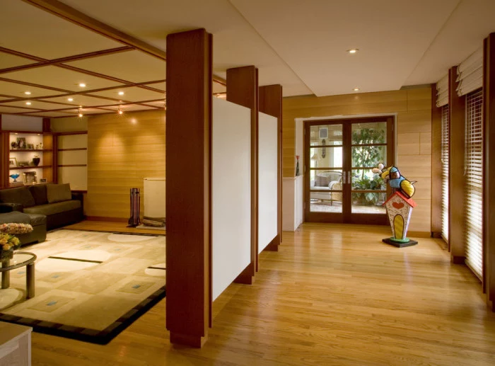 white panels, wooden blocks, large carpet, wooden room dividers, wooden floor and walls