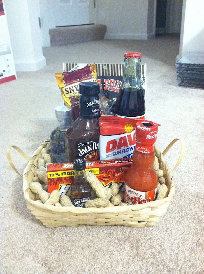 wooden basket, filled with nuts, cool groomsmen gifts, alchohol and soda, different snacks