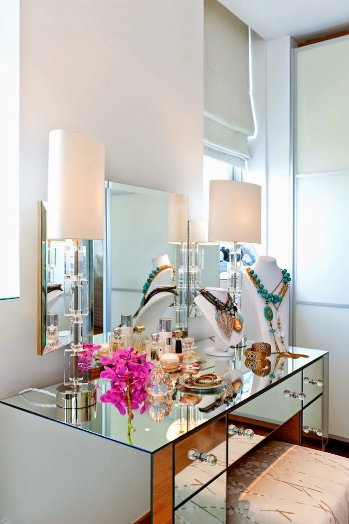 mirrored table, with drawers, three fold mirror, dressing table mirror, white walls, necklaces on mannequins