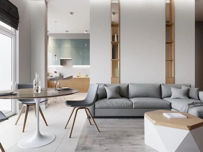grey corner sofa, hexagonal wooden table, room divider screen, round table, grey chairs, wooden bookshelves