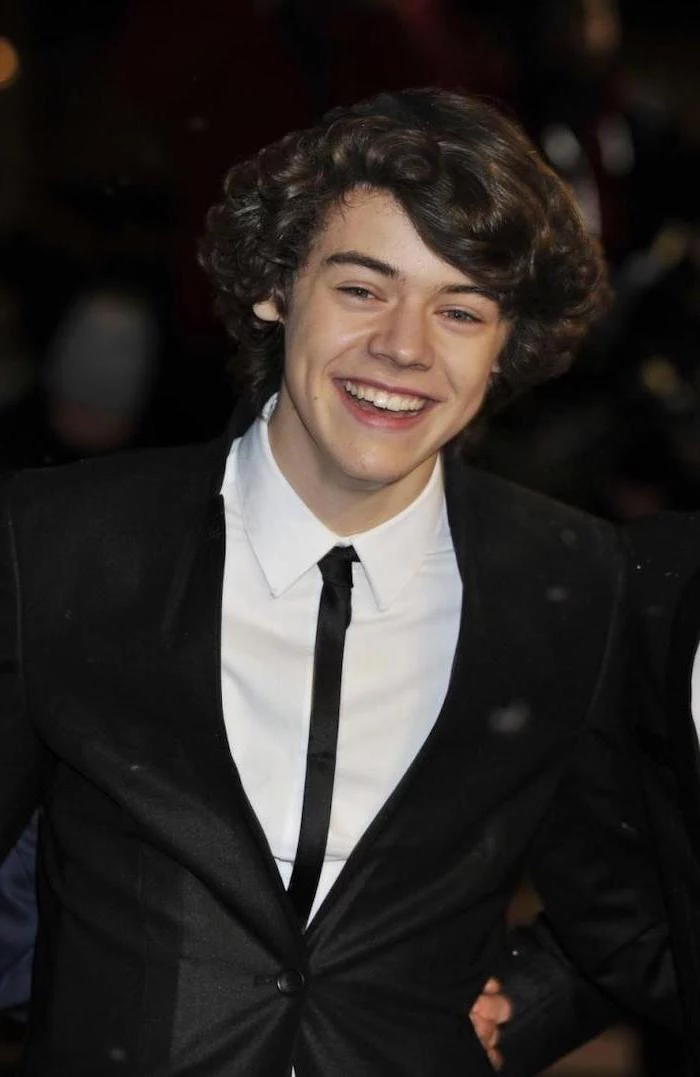 harry styles, smiling at the camera, short curly hair, little black boy haircuts, black blazer, white shirt