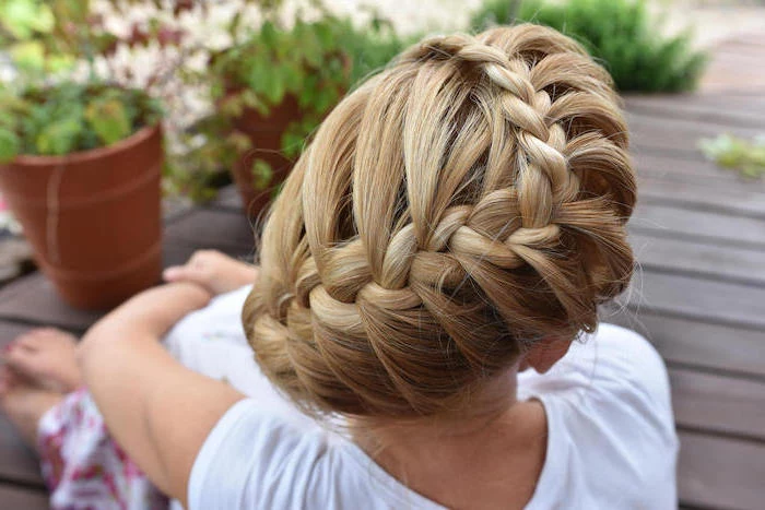 blonde hair, braided updo, white shirt, potted plants, easy braid hairstyles, wooden floor