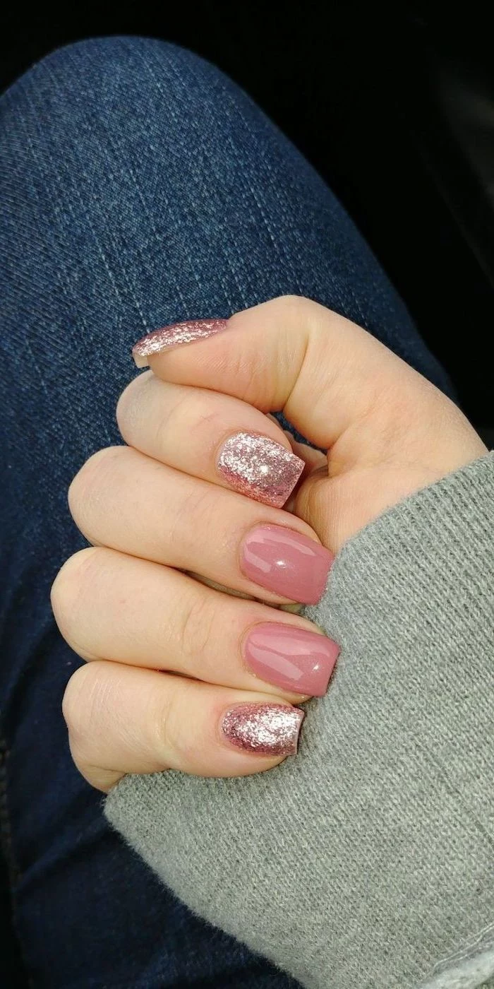 pink and rose gold glitter, nail polish, grey blouse and jeans, nail tip designs, short nails