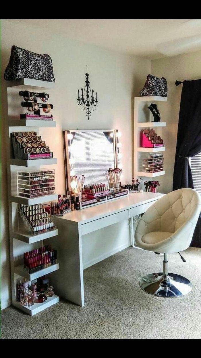 white shelves, lots of make up, white table, makeup vanity chair, white leather, mirror with lights