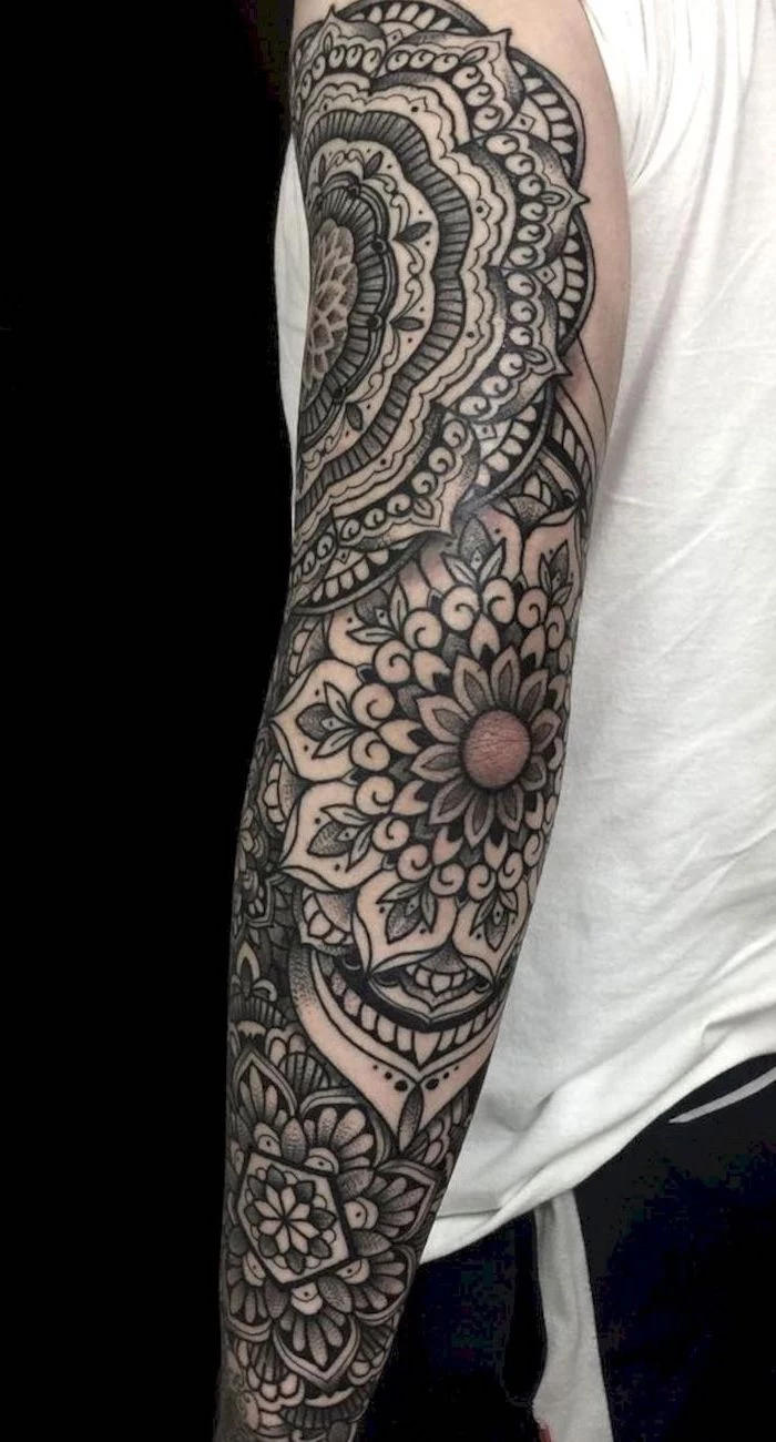 floral mandala, white top, black background, skull sleeve tattoo