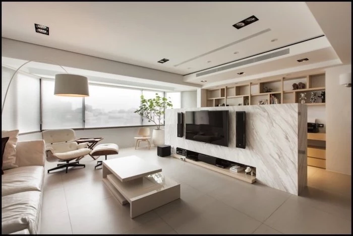 panel room divider, marble wall, wooden shelf, white leather sofa, tiled floor, white armchair