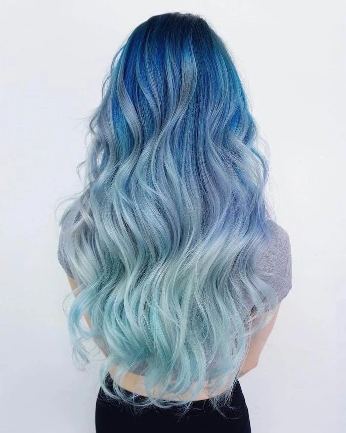 dark blue to light blue, mermaid hair, dark ombre hair, long and wavy, grey top, white background