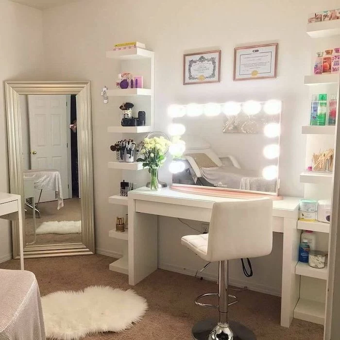 white leather stool, mirror with lights, makeup vanity chair, white table and shelves, lots of products