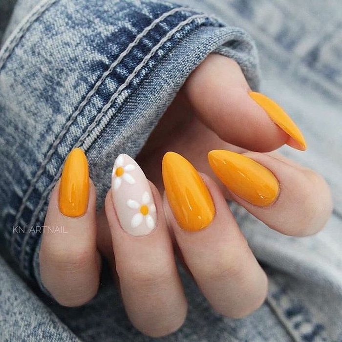 denim jacket, orange nail polish, white daisies, nail color ideas