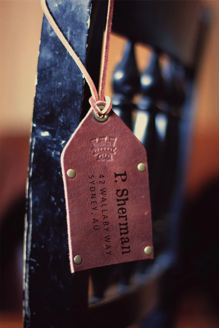 brown leather, luggage tag, groomsmen proposal, personalised with name, black chair