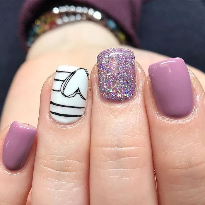 purple and white nail polish, black heart, purple glitter, nail designs for short nails
