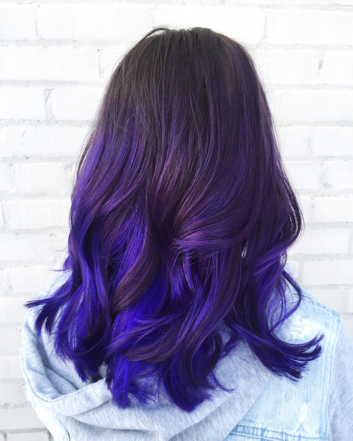 black to purple and blue, medium length, ombre hairstyles, denim jacket, white brick wall