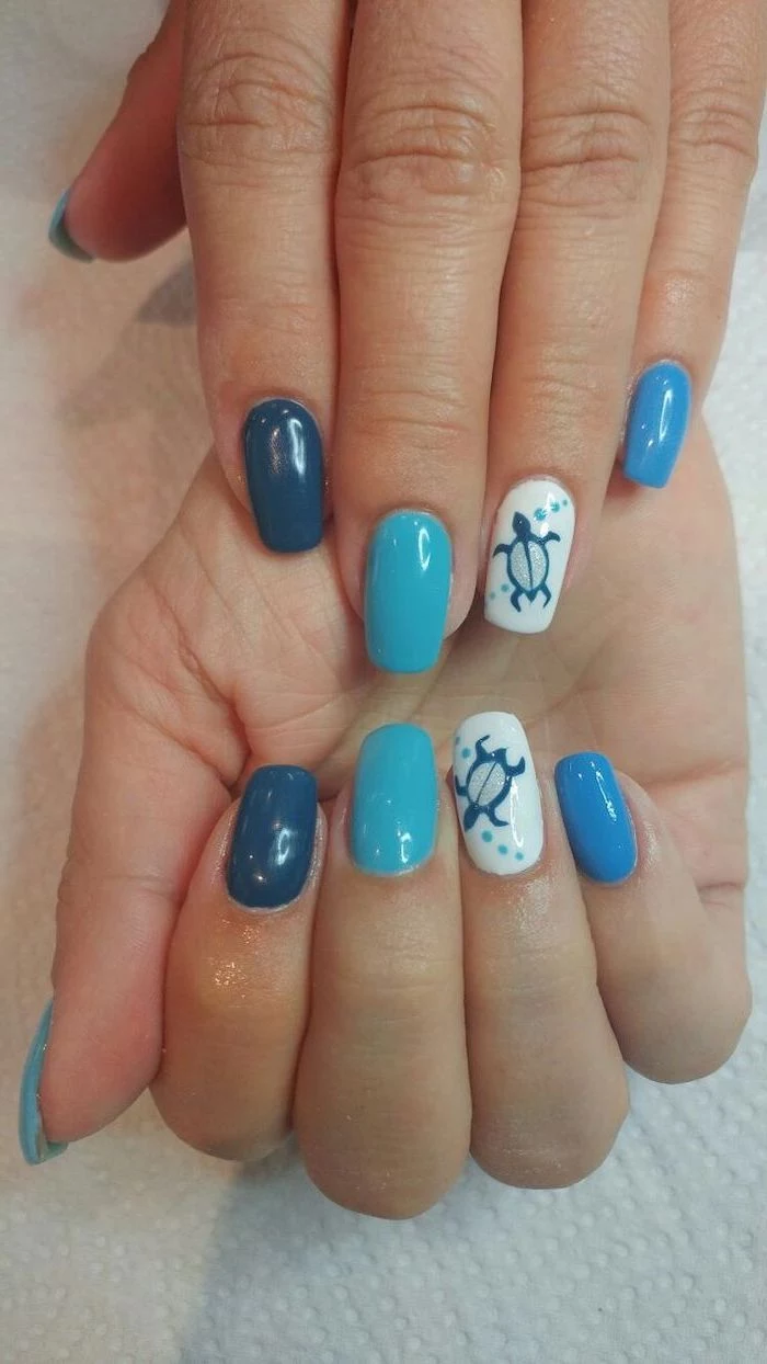 blue and white nail polish, sea turtle drawing, nude nail designs, white background