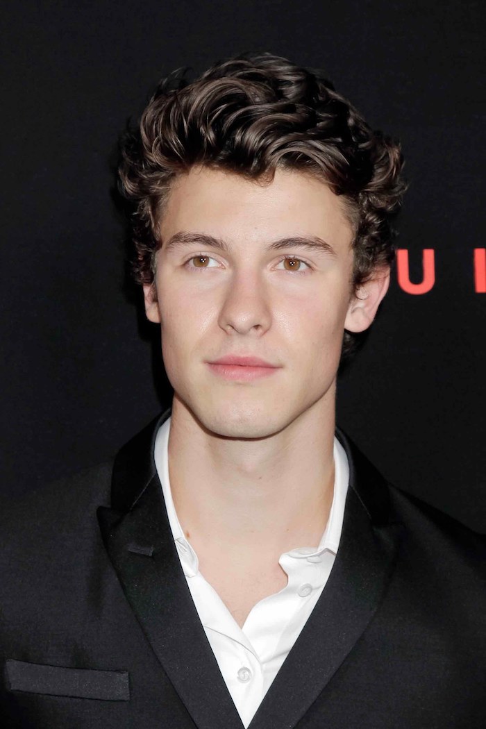 shawn mendes, brown curly hair, cool guy haircuts, black blazer, white shirt