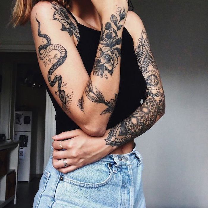 black top, washed jeans, snake and flowers, mandala tattoo, religious tattoo sleeve
