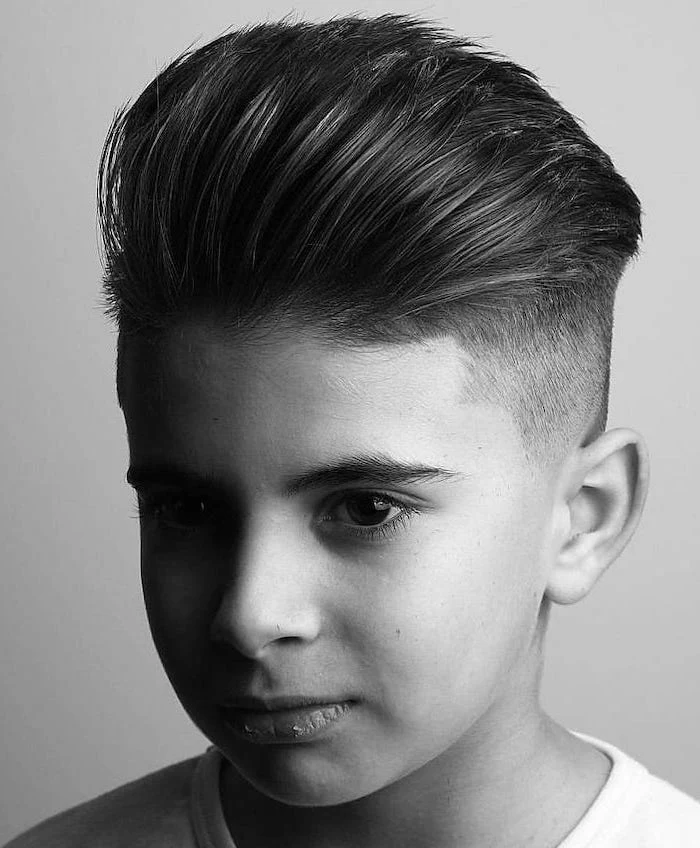 cool hairstyles for men, black and white photo, long top, white shirt