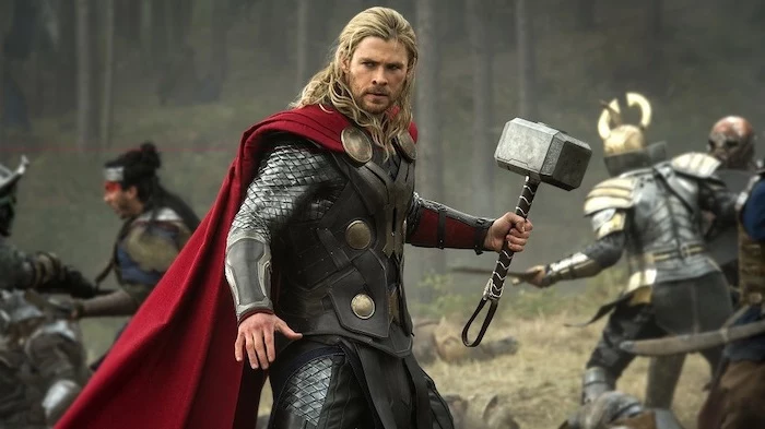 chris hemsworth as thor, holding a hammer, medium length hair men, blonde hair