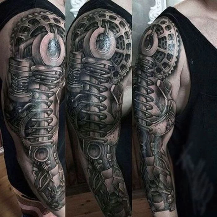 biomechanical tattoo, black top, upper arm tattoos for men, wooden floor