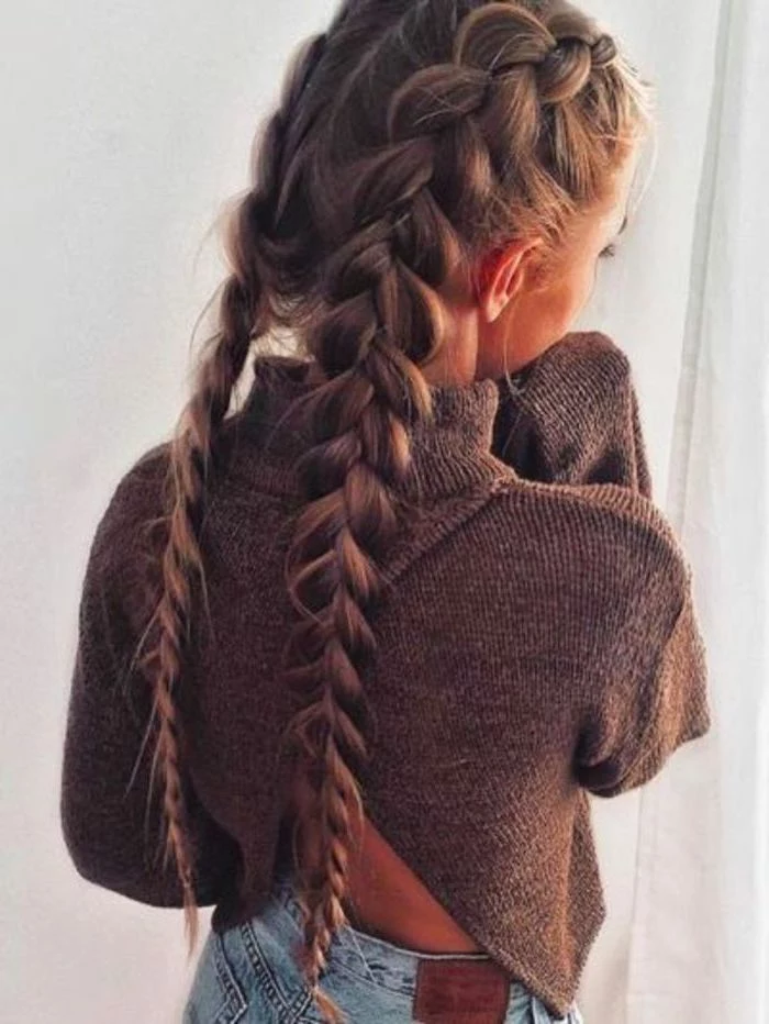 braid hairstyles for long hair, brown hair, two side braids, brown sweater, blue jeans
