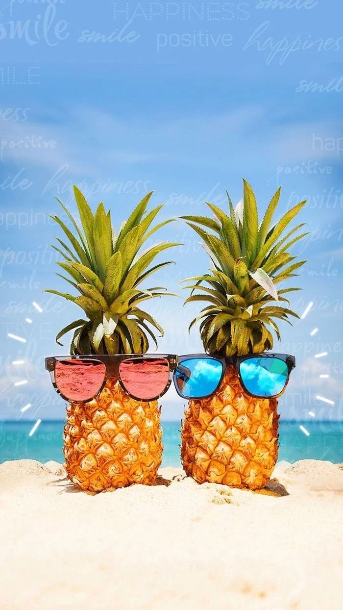 two pineapples, wearing sunglasses, cute computer backgrounds, in the beach sand