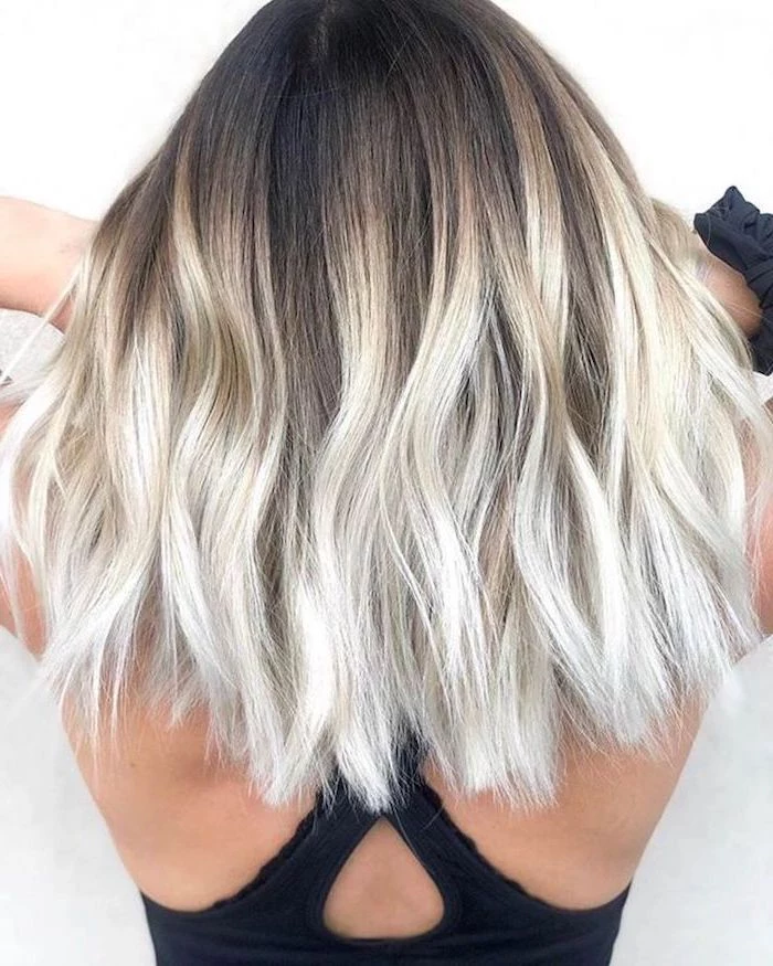 brown to blonde, short wavy bob hairstyle, black top, what is ombre hair, white background